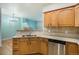 Well-equipped kitchen featuring ample cabinet space, modern appliances, and a breakfast bar at 12710 Jasmine St # C, Thornton, CO 80602