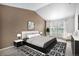 A main bedroom featuring a neutral color scheme, carpet, and a large window for plenty of natural light at 12710 Jasmine St # C, Thornton, CO 80602