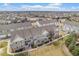 View of well-maintained townhomes with stone accents, landscaping, and a glimpse of a Gathering-friendly neighborhood at 12710 Jasmine St # C, Thornton, CO 80602