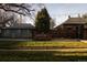 Landscaped backyard with patio and outdoor dining area offering a serene and private retreat at 4631 Zuni St, Denver, CO 80211