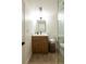 Bathroom featuring a glass-enclosed shower, a vanity, and a toilet at 4631 Zuni St, Denver, CO 80211