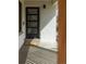 Welcoming front entrance with a modern door, sleek lighting, and a cozy 