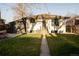 Charming home featuring a well-manicured lawn and inviting walkway at 4631 Zuni St, Denver, CO 80211