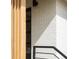 Charming front porch features sleek white brick, modern lighting, and stylish black railing for a contemporary feel at 4631 Zuni St, Denver, CO 80211