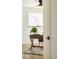 Bright home office featuring a ceiling fan, wooden desk, stylish decor, and a plush rug at 4631 Zuni St, Denver, CO 80211