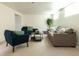Spacious living room featuring large sofas and comfortable armchairs bathed in natural light at 4631 Zuni St, Denver, CO 80211