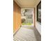 Covered porch with vertical wood slats, painted brick wall, and plenty of natural light at 4631 Zuni St, Denver, CO 80211