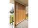Covered porch has natural wood features, black railings, and offers outdoor enjoyment at 4631 Zuni St, Denver, CO 80211