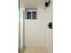 Modern shower featuring white tiling, window, and black fixtures at 4631 Zuni St, Denver, CO 80211