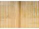 View of natural wood slats, providing privacy and a modern aesthetic to the home at 4631 Zuni St, Denver, CO 80211