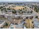 Aerial view of townhomes showcases surrounding neighborhood with a park nearby at 4250 S Olive St # 108, Denver, CO 80237