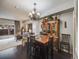 Elegant dining area with a decorative hutch, wooden table, and views into the adjacent living room at 4250 S Olive St # 108, Denver, CO 80237