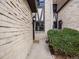 Inviting entrance to the property featuring well-maintained brickwork and lush greenery at 4250 S Olive St # 108, Denver, CO 80237