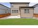 Beautiful backyard featuring a green lawn, stone area, and fenced perimeter at 933 Canal West Dr, Brighton, CO 80603