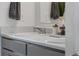 Well-lit bathroom featuring a clean vanity with modern fixtures and decor at 933 Canal West Dr, Brighton, CO 80603