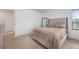 Inviting bedroom with soft carpet, natural light, and calming neutral tones at 933 Canal West Dr, Brighton, CO 80603