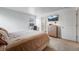 Cozy bedroom featuring a mounted television, stylish storage, and a sleek workspace at 933 Canal West Dr, Brighton, CO 80603