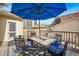 Inviting back deck features a table with seating for six under a bright blue umbrella at 1368 N Gilpin St, Denver, CO 80218