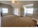 Spacious bedroom with two windows, carpet flooring, and double door closet at 1368 N Gilpin St, Denver, CO 80218