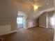 Bedroom features angled ceilings, neutral carpet, two windows and radiator heating at 1368 N Gilpin St, Denver, CO 80218