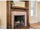 Close up of a fireplace showcasing the wooden mantle and tile surround at 1368 N Gilpin St, Denver, CO 80218