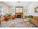 Inviting living room with a fireplace, stained glass windows, and hardwood floors at 1368 N Gilpin St, Denver, CO 80218