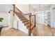 Staircase features decorative tile risers, wooden handrail, and bright entry at 1368 N Gilpin St, Denver, CO 80218