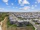 An aerial perspective showcases the neighborhood's design with landscaped properties and interconnecting streets at 16371 Jones Mountain Way, Broomfield, CO 80023