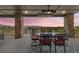 Covered back deck with stone columns and mountain views, perfect for outdoor entertaining at 16371 Jones Mountain Way, Broomfield, CO 80023