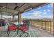 Covered back deck with stone columns and mountain views, perfect for outdoor entertaining at 16371 Jones Mountain Way, Broomfield, CO 80023