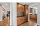 Convenient butler's pantry features wooden cabinets, a sink and ample storage with easy access to the kitchen at 16371 Jones Mountain Way, Broomfield, CO 80023