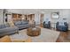 Open-concept living room flows into the kitchen, ideal for entertaining and Gathering gatherings at 16371 Jones Mountain Way, Broomfield, CO 80023