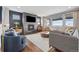 Cozy living room featuring a modern fireplace and comfortable seating at 16371 Jones Mountain Way, Broomfield, CO 80023
