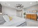 Bright main bedroom featuring neutral tones, a modern fan, and wood furniture at 16371 Jones Mountain Way, Broomfield, CO 80023