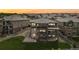 Spacious two-story home with multiple balconies, a patio, stairs and a grass covered backyard at 16371 Jones Mountain Way, Broomfield, CO 80023