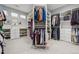 Spacious walk-in closet with custom shelving and ample storage space at 16371 Jones Mountain Way, Broomfield, CO 80023