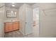 Bright bathroom features ample cabinet space and a view into the bedroom at 3784 Whitetail Ct, Mead, CO 80542