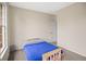 Bedroom featuring a light wood bedframe, neutral carpet and a single window at 3784 Whitetail Ct, Mead, CO 80542