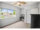 Bedroom features a large window showcasing exterior views, light walls and neutral carpet at 3784 Whitetail Ct, Mead, CO 80542