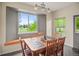 Kitchen dining area with built-in window seat and wooden table at 3784 Whitetail Ct, Mead, CO 80542