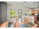 Inviting dining area with views of the backyard, seamlessly connecting to the kitchen at 3784 Whitetail Ct, Mead, CO 80542