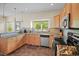 Kitchen with granite countertops and light wood cabinets at 3784 Whitetail Ct, Mead, CO 80542