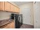 Laundry room with granite countertop and front load washer and dryer at 3784 Whitetail Ct, Mead, CO 80542