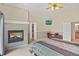 Main bedroom with fireplace, and access to the bathroom and closet at 3784 Whitetail Ct, Mead, CO 80542