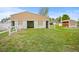 Image of an outbuilding featuring sliding doors, adjacent to the main house on a well-maintained lawn at 3784 Whitetail Ct, Mead, CO 80542