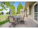 Relaxing outdoor space featuring a dining table and seating under the shade of mature trees at 3784 Whitetail Ct, Mead, CO 80542