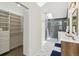 Bright bathroom features a walk-in closet, double vanity, and a skylight at 7309 Windsor Dr, Boulder, CO 80301