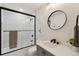 Contemporary bathroom featuring modern fixtures and a shower with glass door at 7309 Windsor Dr, Boulder, CO 80301