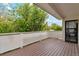 A lovely wood deck is enclosed by a white railing and offers great outdoor space for entertaining and relaxation at 7309 Windsor Dr, Boulder, CO 80301