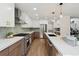 Spacious kitchen with stainless steel appliances, quartz countertops, a breakfast bar, and ample storage space at 7309 Windsor Dr, Boulder, CO 80301